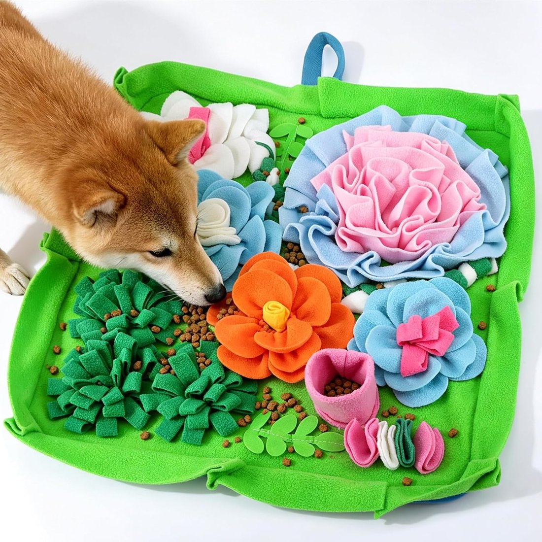 A shiba inu foraging on the AWOOF flower garden snuffle mat